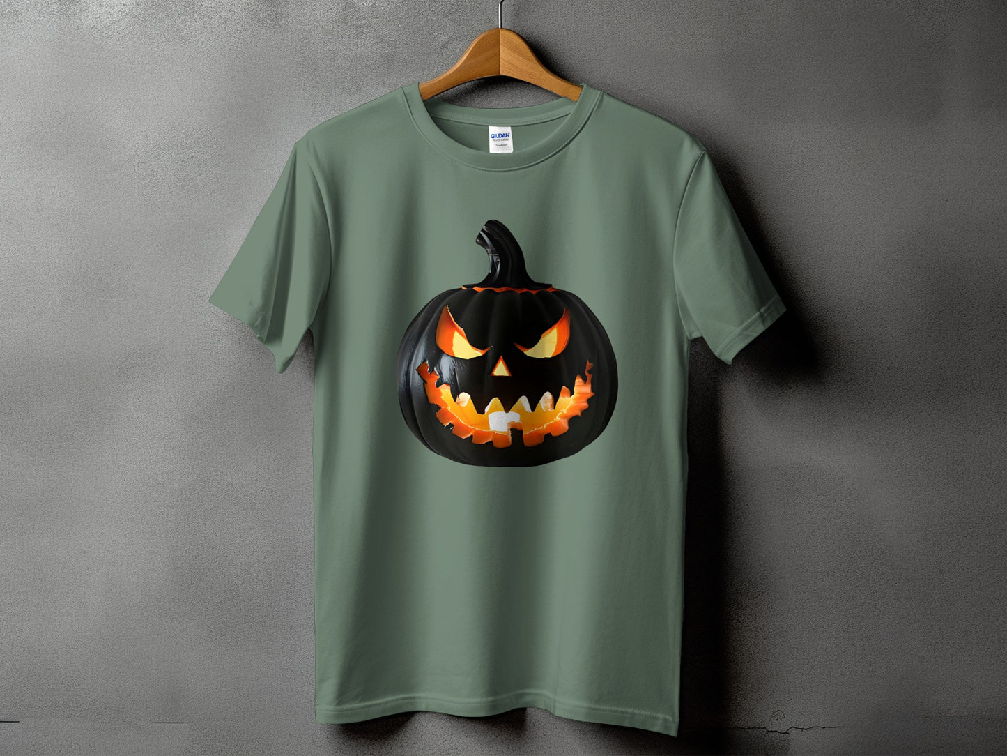 Green t-shirt with a black jack-o'-lantern graphic featuring glowing orange eyes and mouth.
