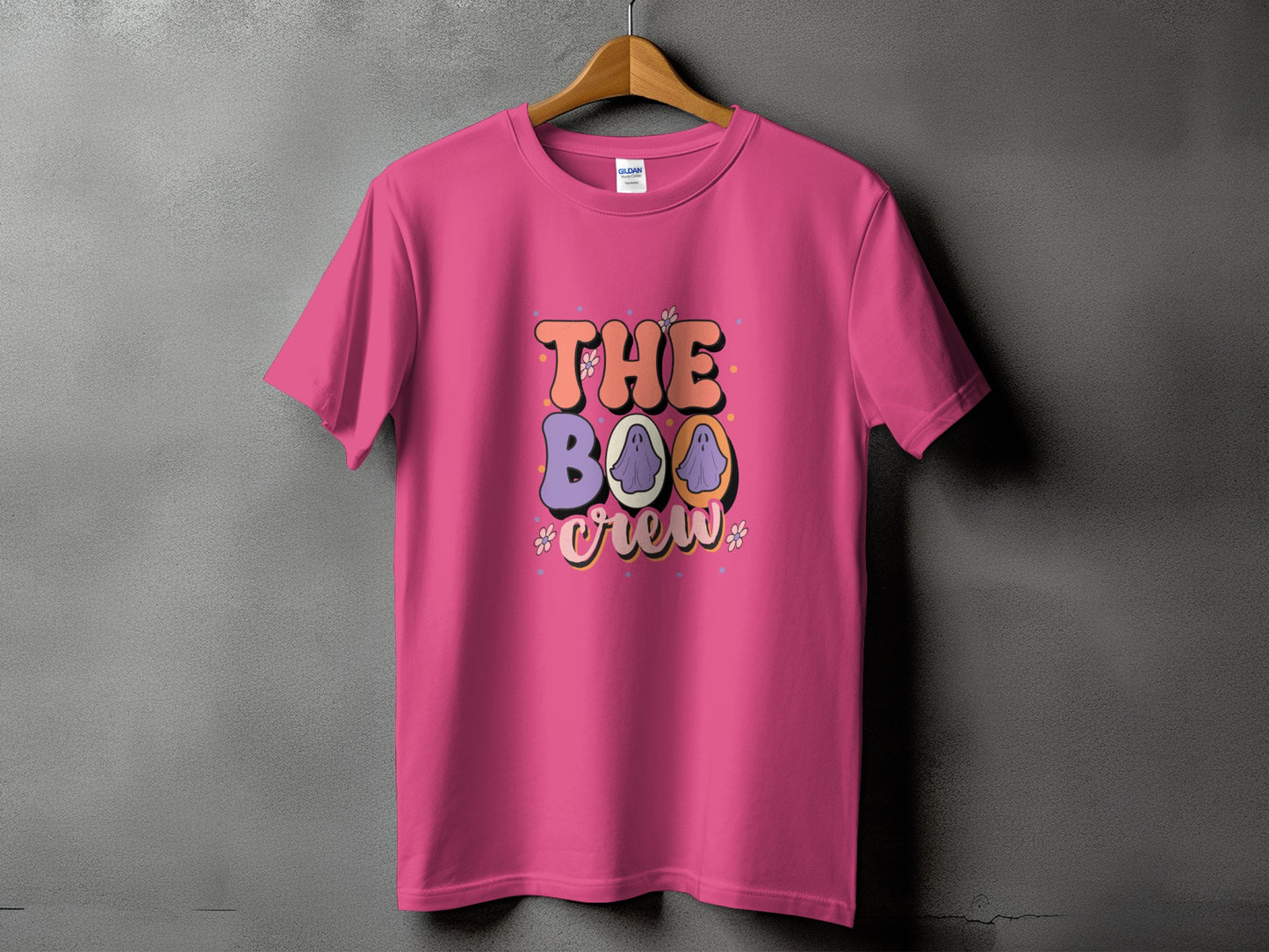 Pink t-shirt with "The Boo Crew" text and ghost graphics.