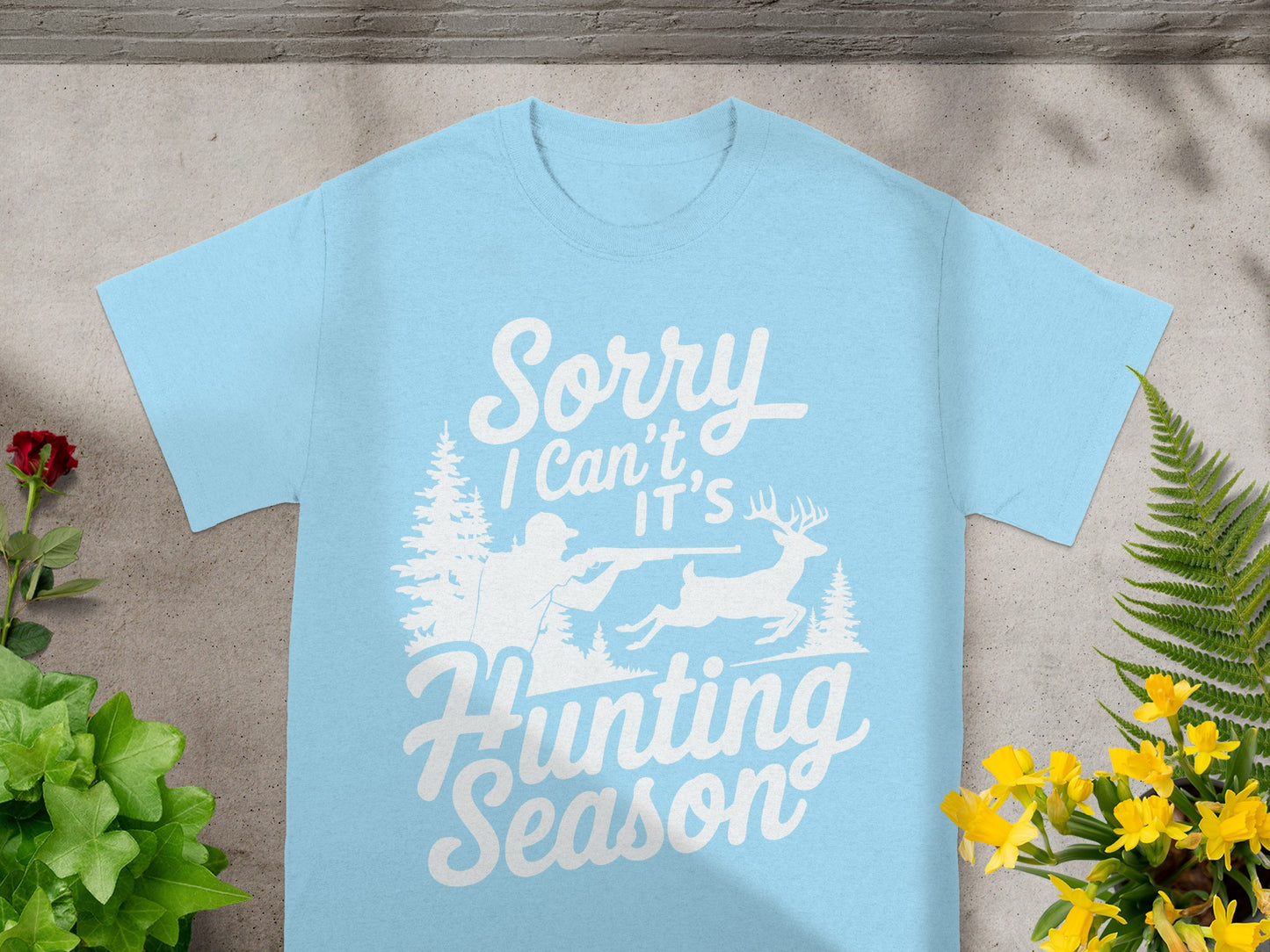 Light blue t-shirt with "Sorry I Can't It's Hunting Season" graphic.