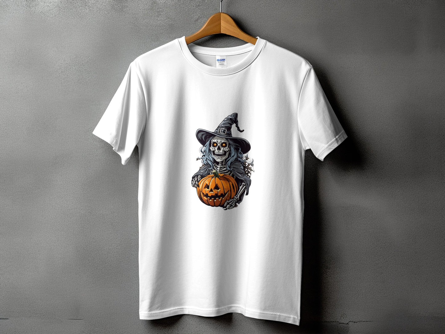 White t-shirt with skeleton in witch hat holding jack-o'-lantern graphic.