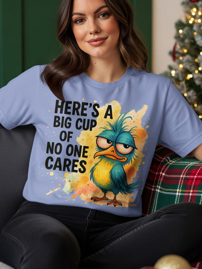 Blue t-shirt with a grumpy bird and text "HERE'S A BIG CUP OF NO ONE CARES".