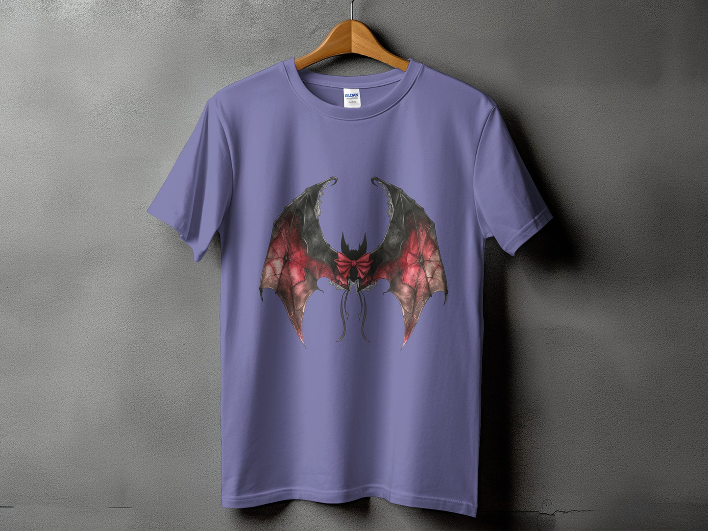 Purple t-shirt with a detailed gothic bat wing design and a red bow.