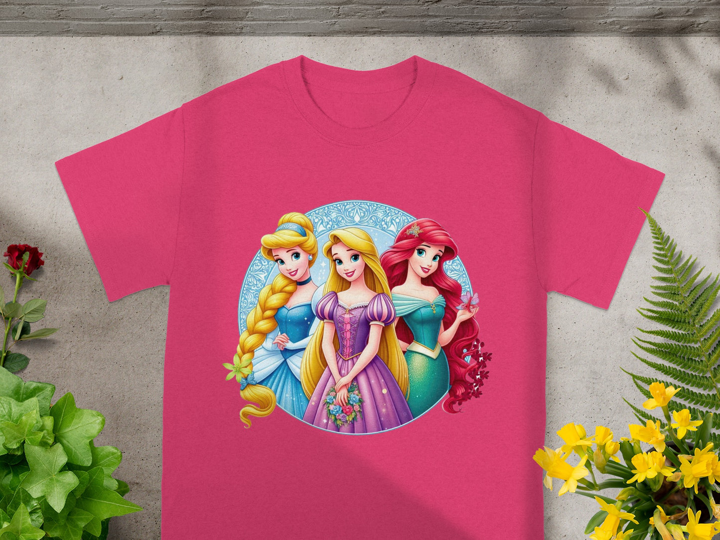 Pink t-shirt with Cinderella, Belle, and Ariel from Disney's The Little Mermaid.