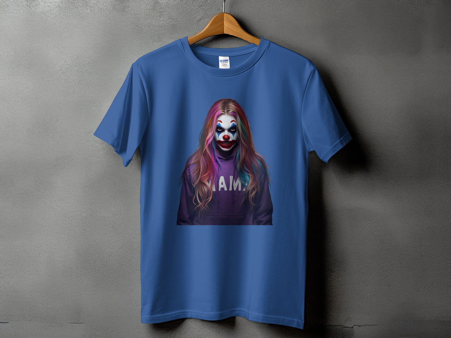 Blue t-shirt with graphic of a woman with clown makeup and "MAMA" on hoodie.