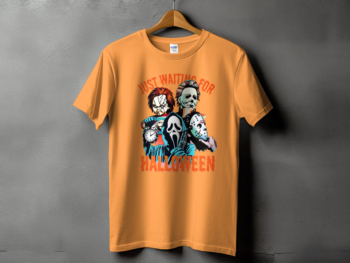 Orange t-shirt featuring Chucky, Michael Myers, Ghostface, and Jason Voorhees with "Just Waiting For Halloween" text.