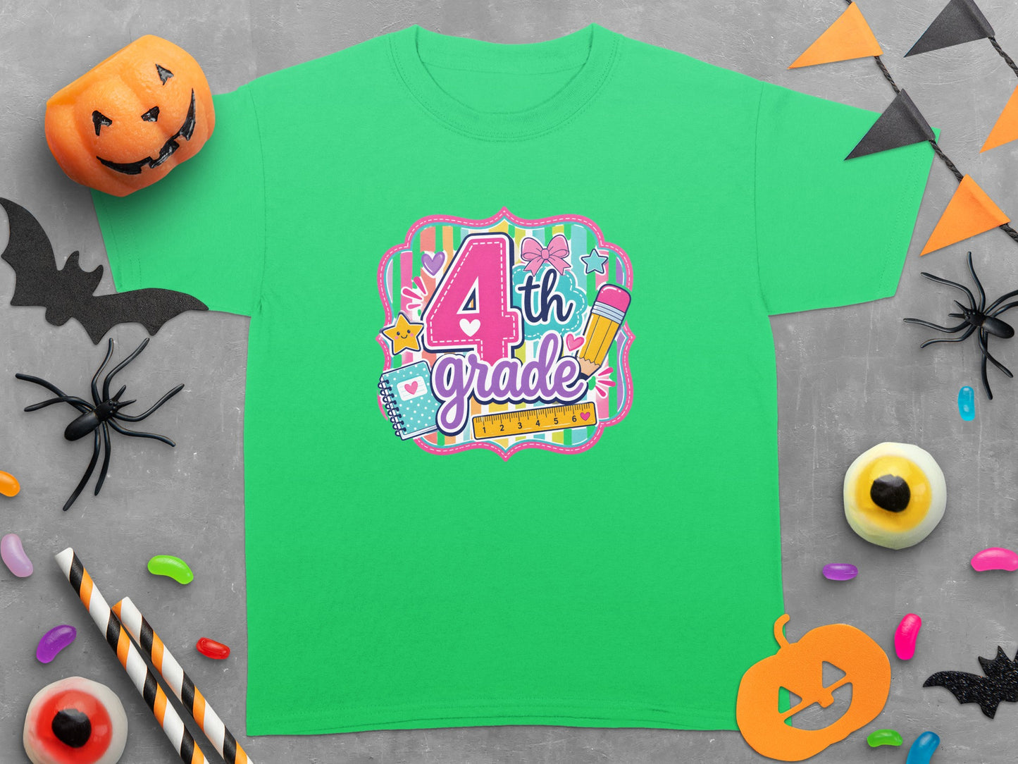 Green t-shirt with "4th grade" design, surrounded by Halloween decorations.