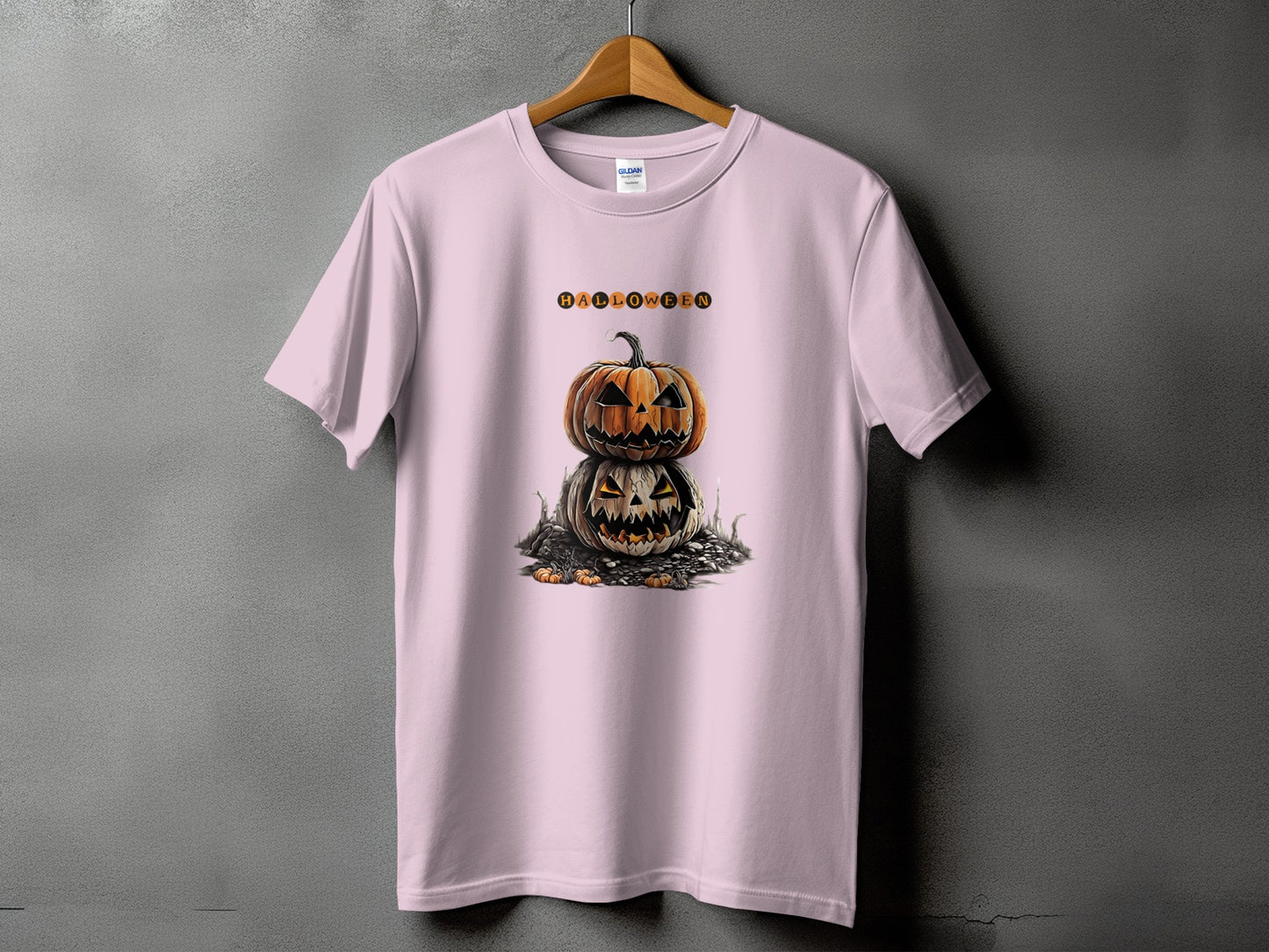 Pink t-shirt with stacked jack-o'-lanterns and "Halloween" text graphic.