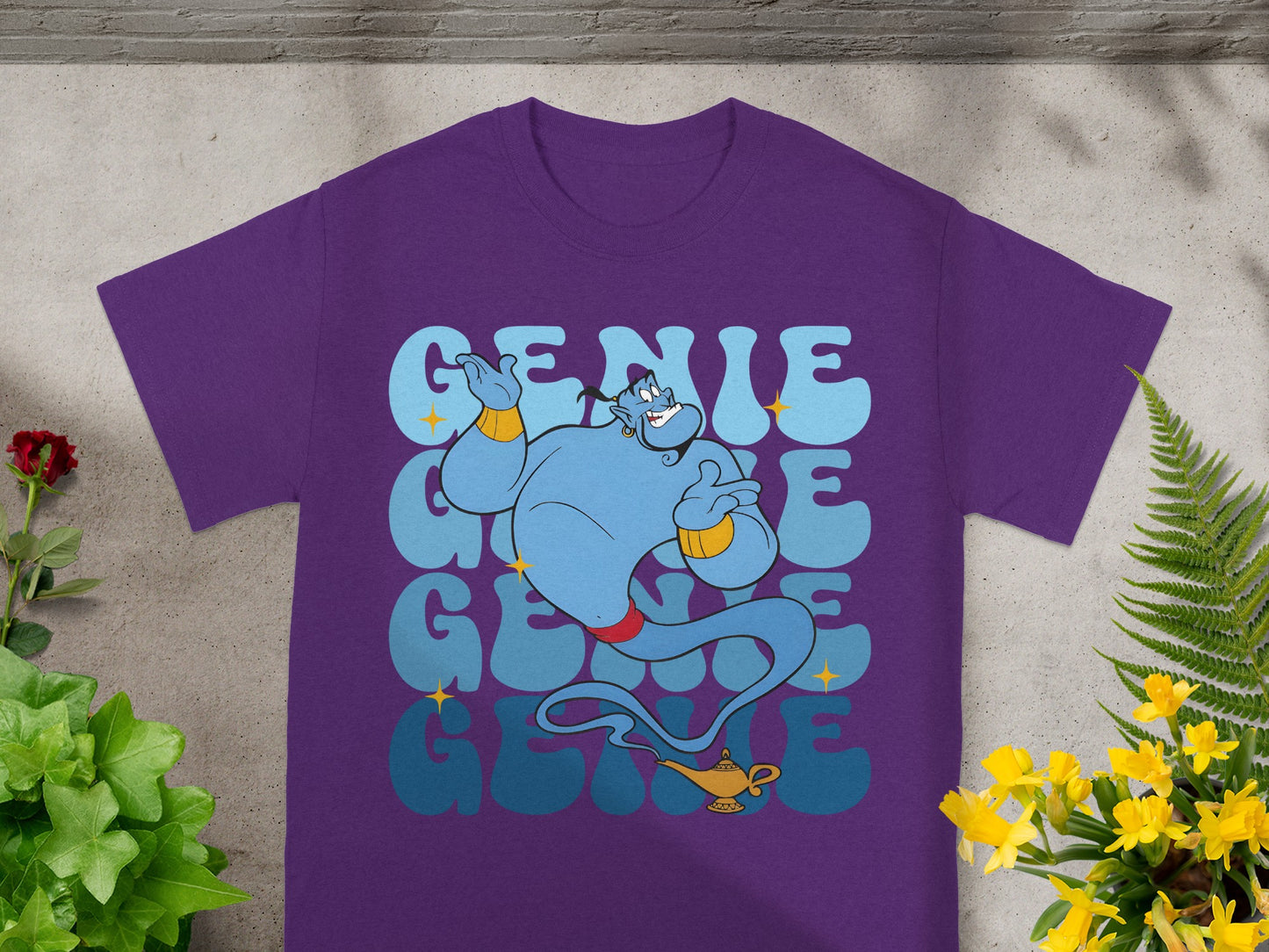 Purple t-shirt with blue genie graphic and "Genie" text.