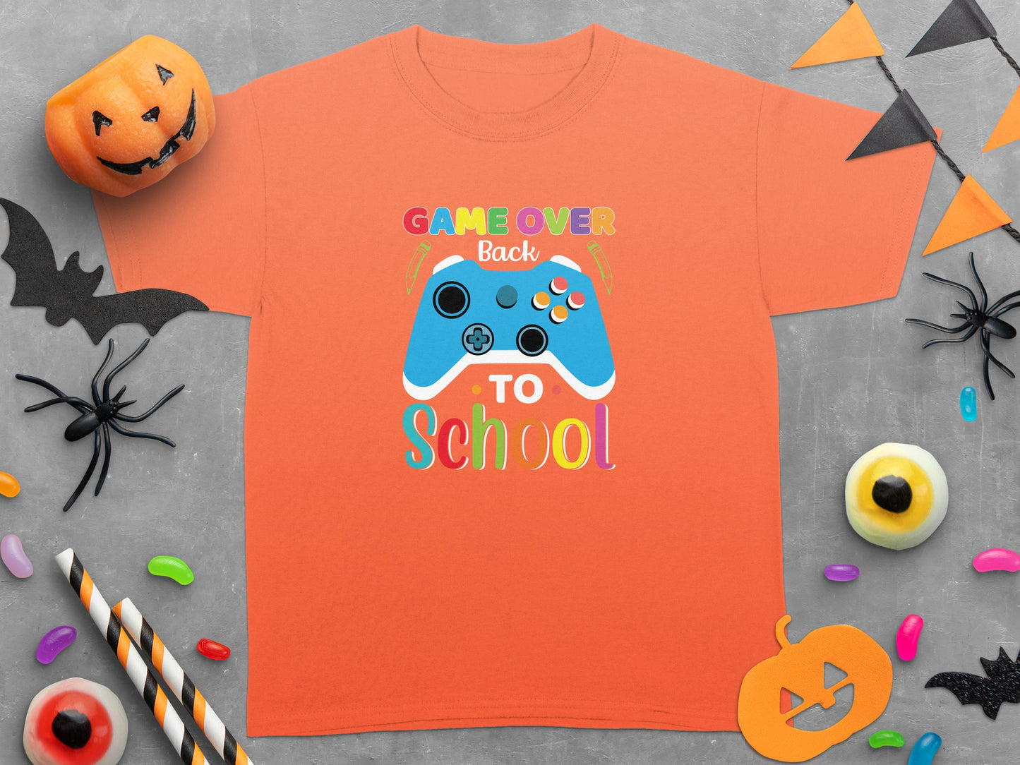 Orange t-shirt with "Game Over Back to School" graphic featuring a blue video game controller.