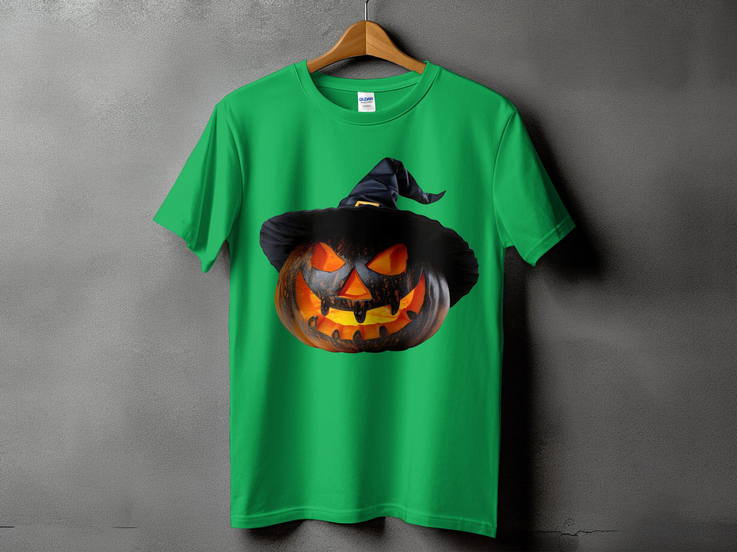 Green t-shirt with a spooky jack-o'-lantern wearing a witch hat design.