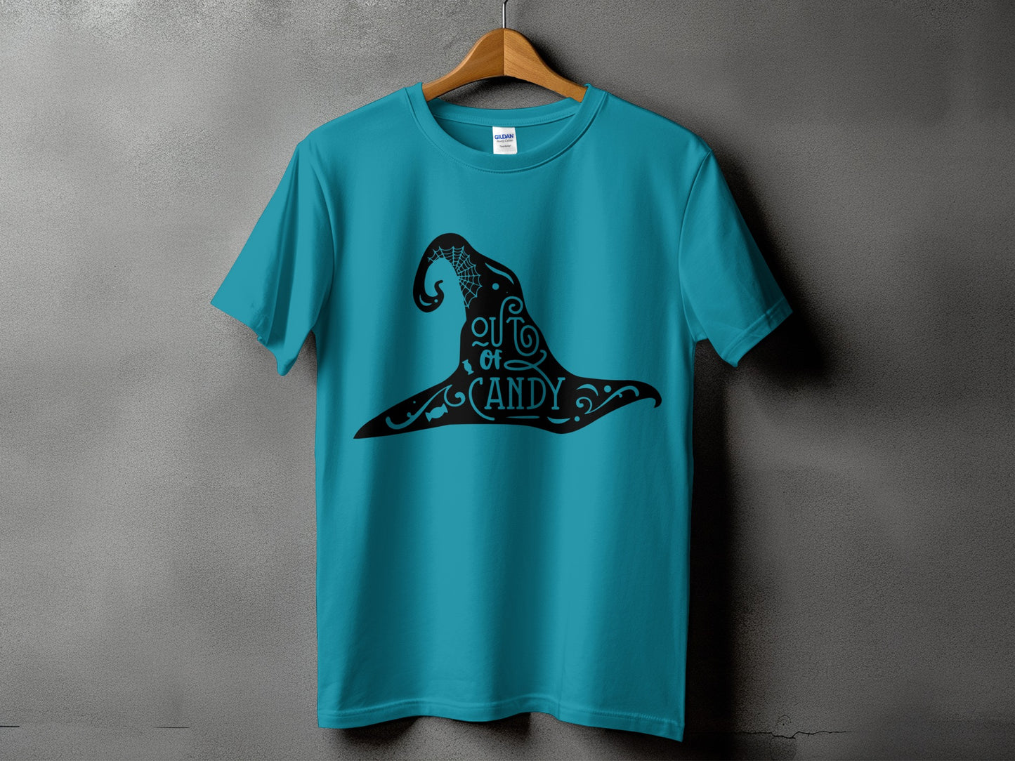 Turquoise t-shirt with black witch hat graphic and "out of candy" text.