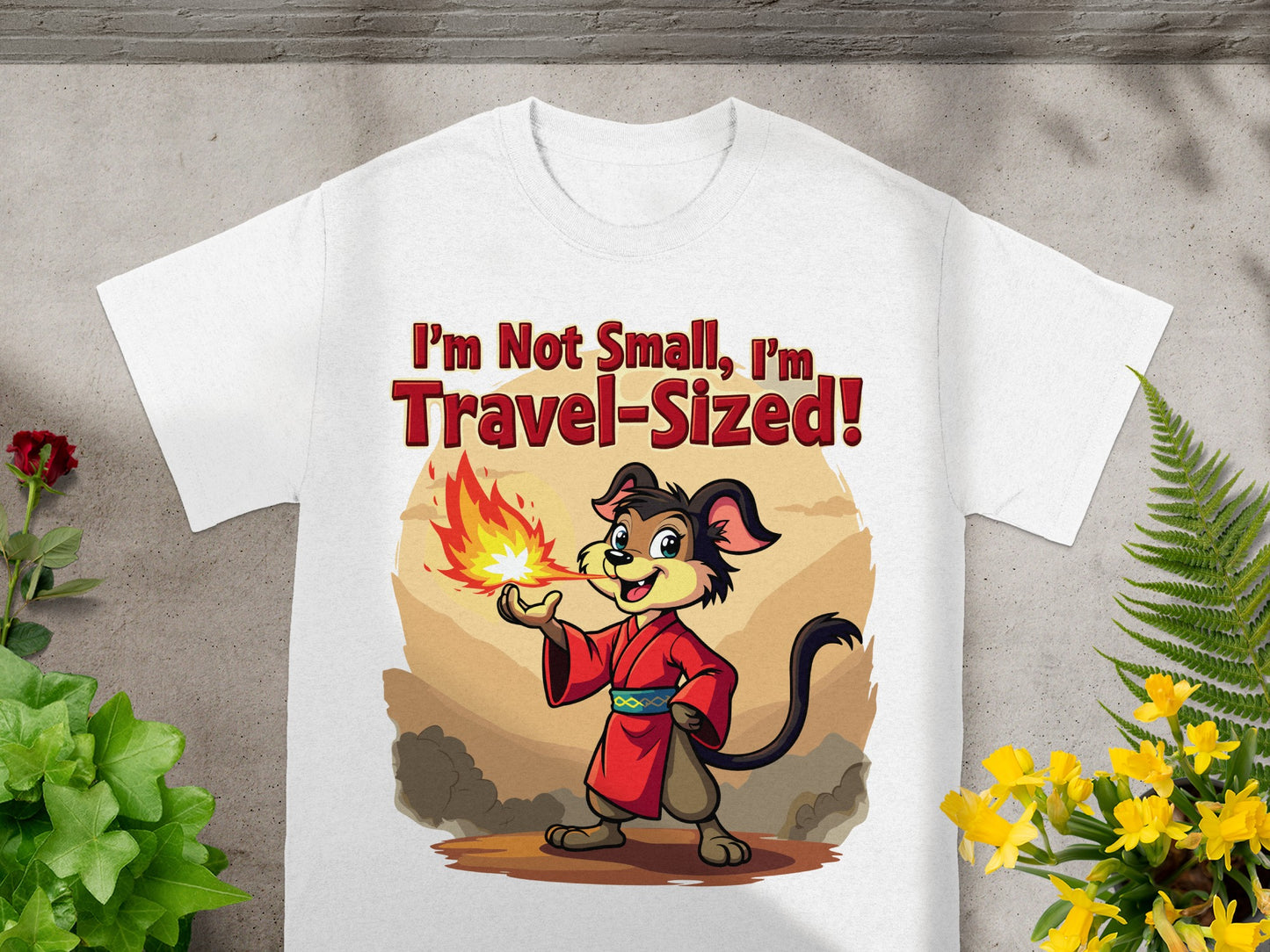 White t-shirt with cartoon dog breathing fire and text "I'm Not Small, I'm Travel-Sized!".