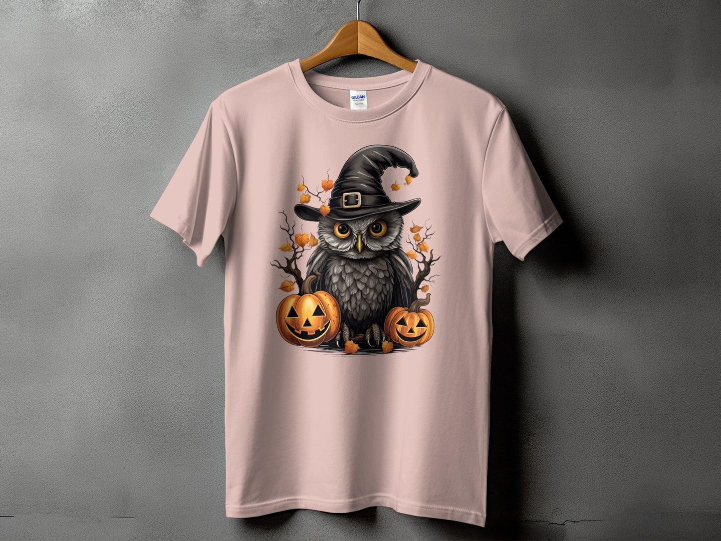 Pink t-shirt with Halloween owl graphic and pumpkins.