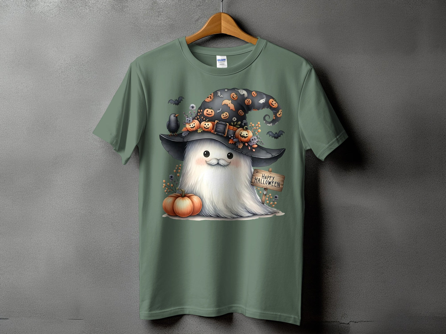 Green t-shirt with a cute ghost in a witch hat, pumpkins, bats, and "Happy Halloween" sign.