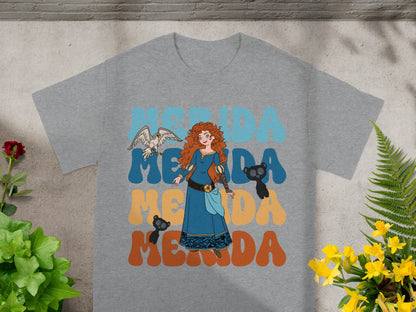 Merida with bird and bear on graphic t-shirt, text reads Merida.