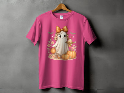 Pink t-shirt with a cute ghost holding a drink, surrounded by pumpkins and flowers.