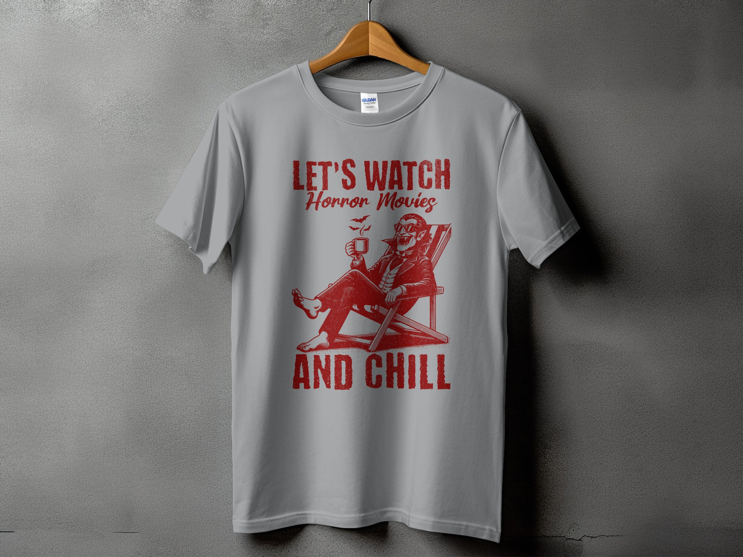 Grey t-shirt with red graphic and text "Let's Watch Horror Movies And Chill"