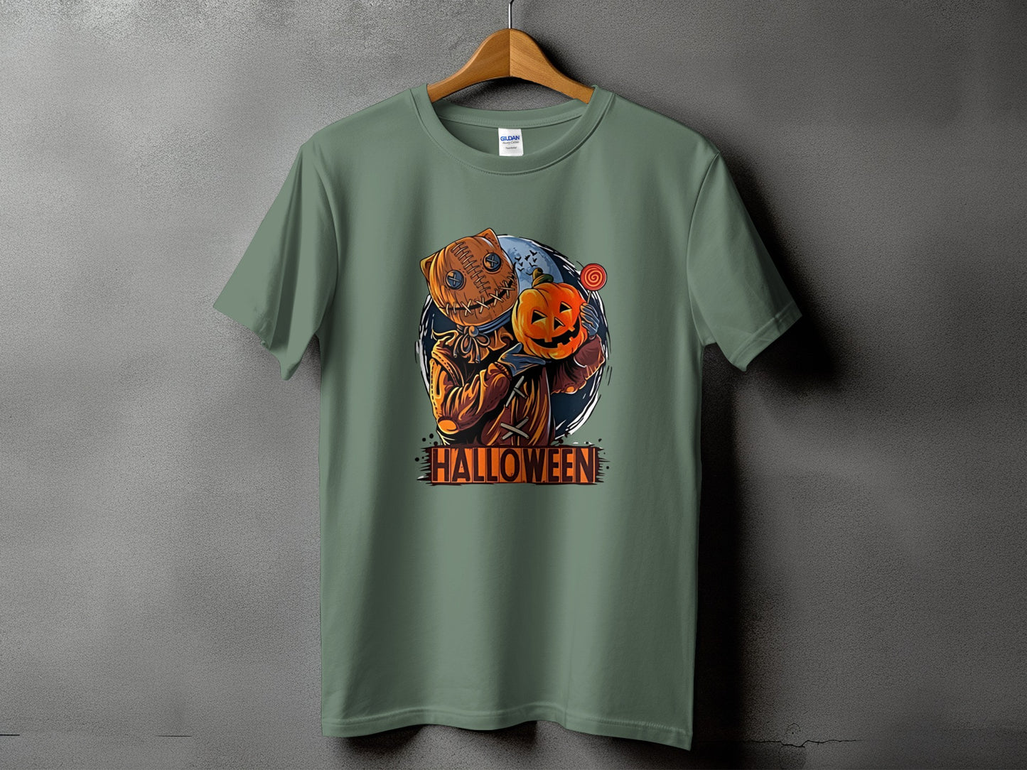 T-shirt with a scarecrow character holding a pumpkin and a lollipop, text reads Halloween.