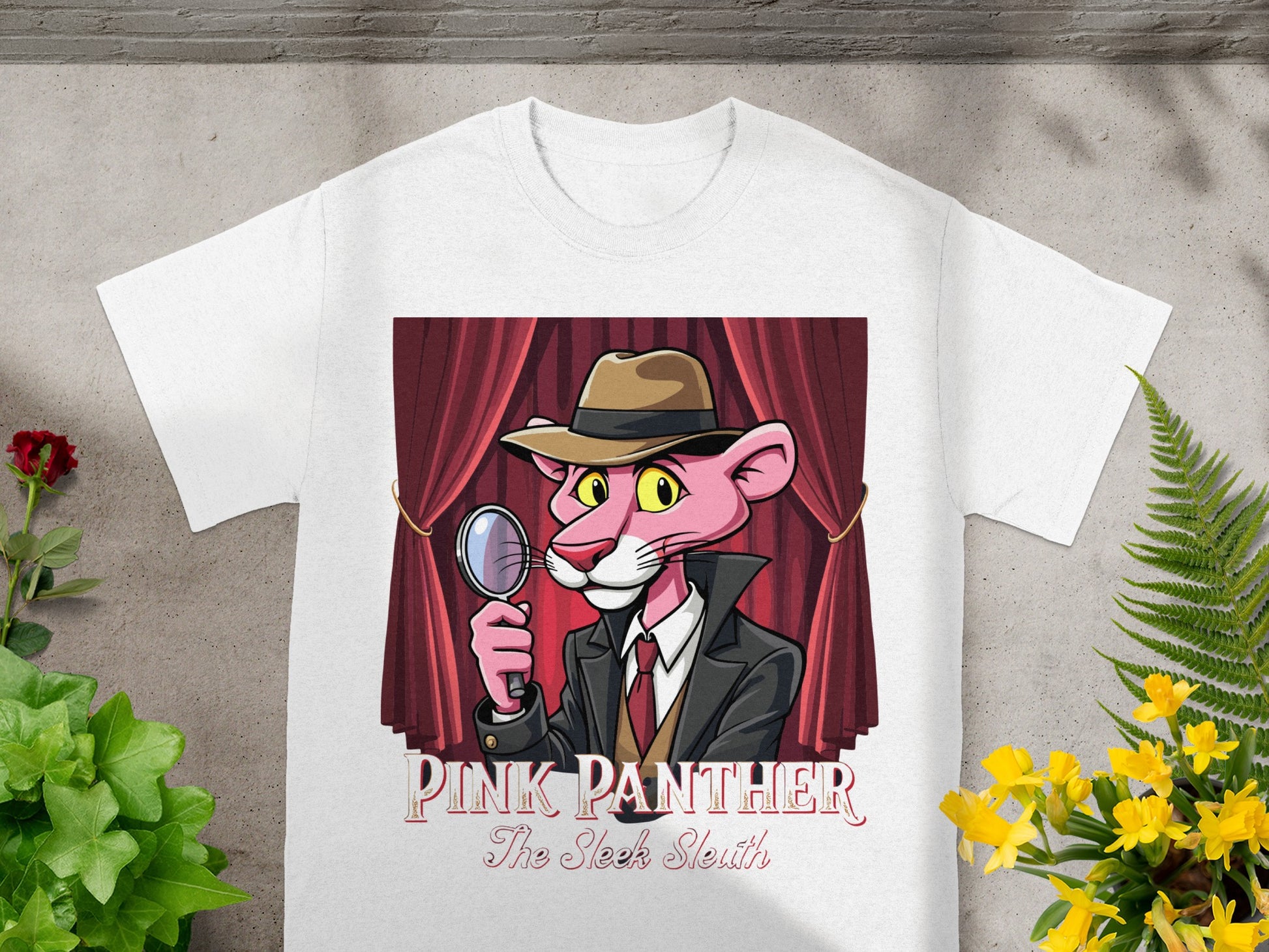 Pink Panther graphic on white t-shirt holding a magnifying glass, with "Pink Panther The Sleek Sleuth" text.
