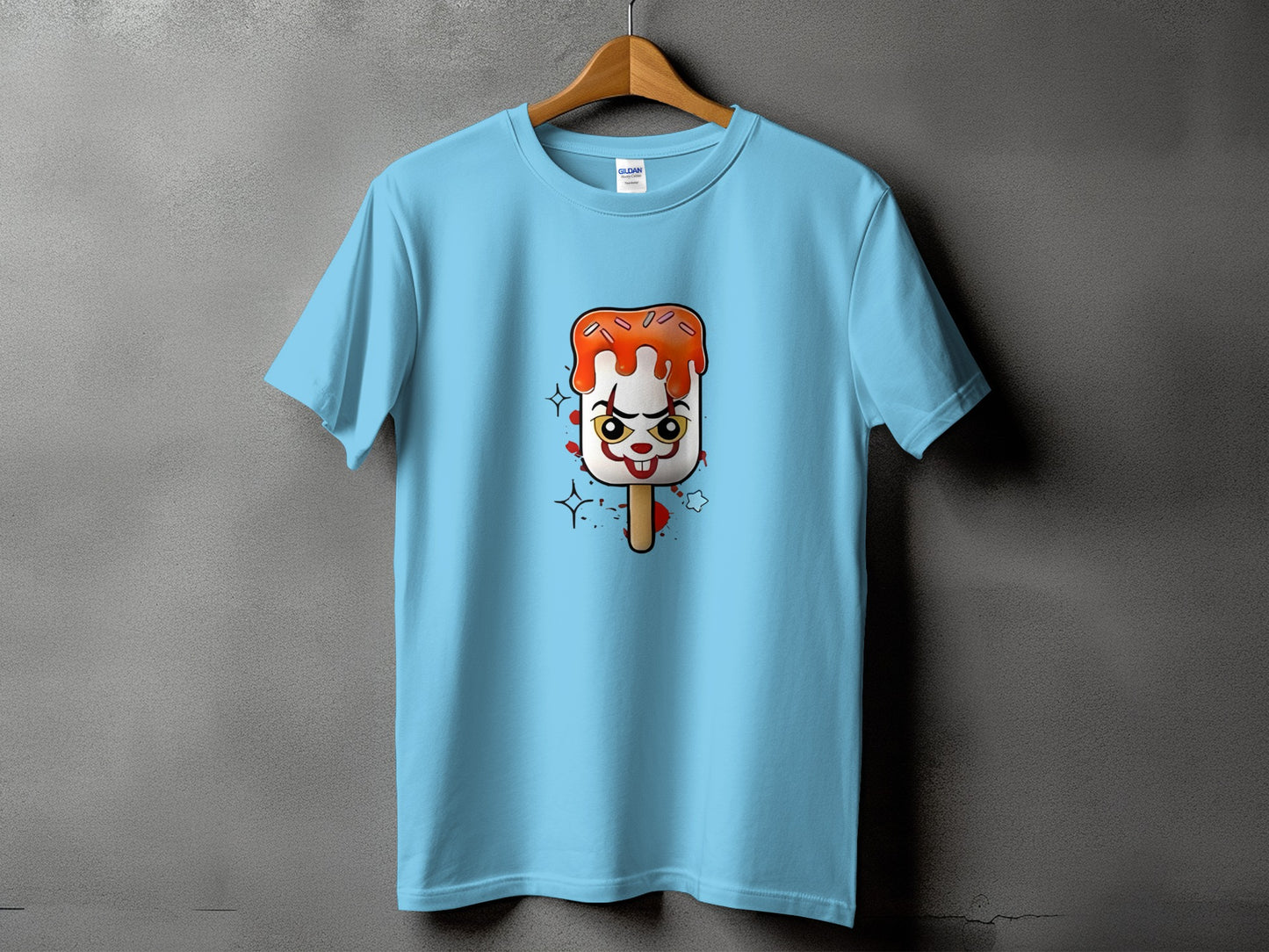 Light blue t-shirt with a creepy clown popsicle graphic.
