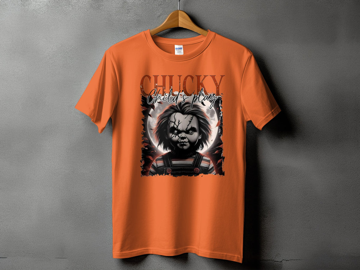 Orange t-shirt with Chucky from Child's Play graphic and text.
