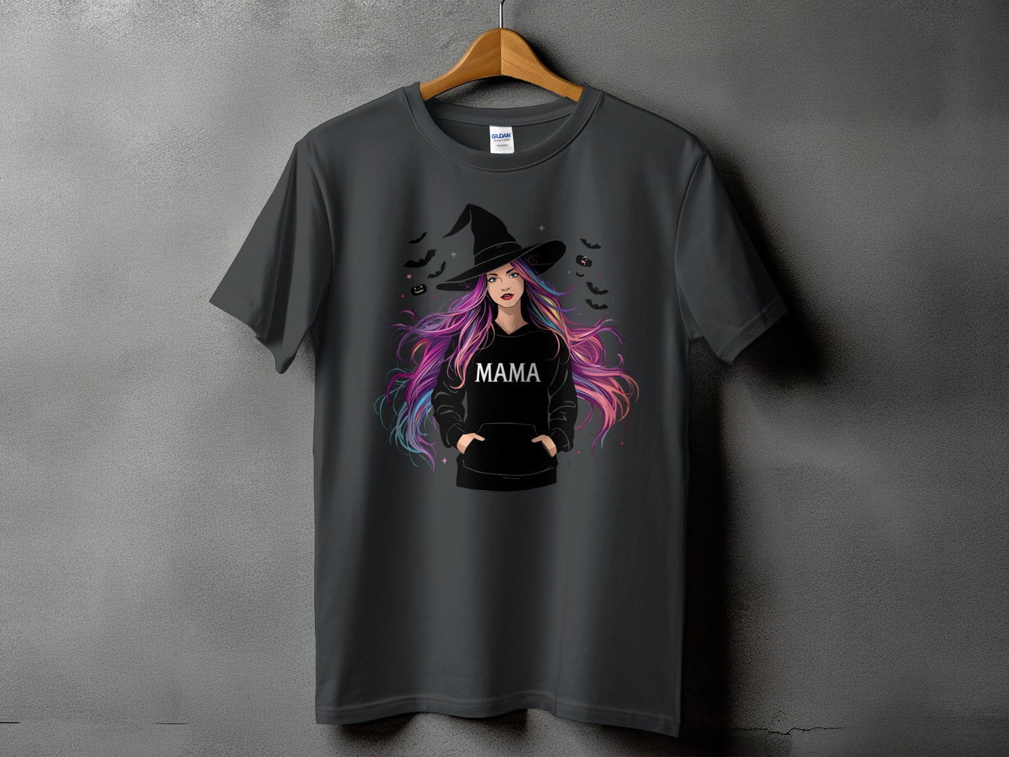 Dark gray t-shirt featuring a witch with colorful hair and the word "MAMA".