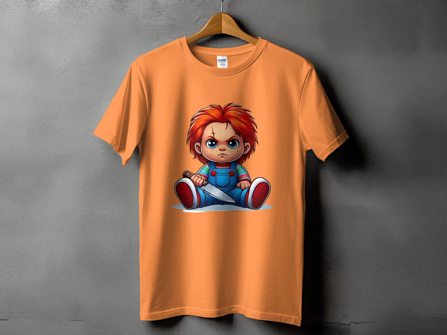 Orange t-shirt with Chucky doll graphic holding a knife.