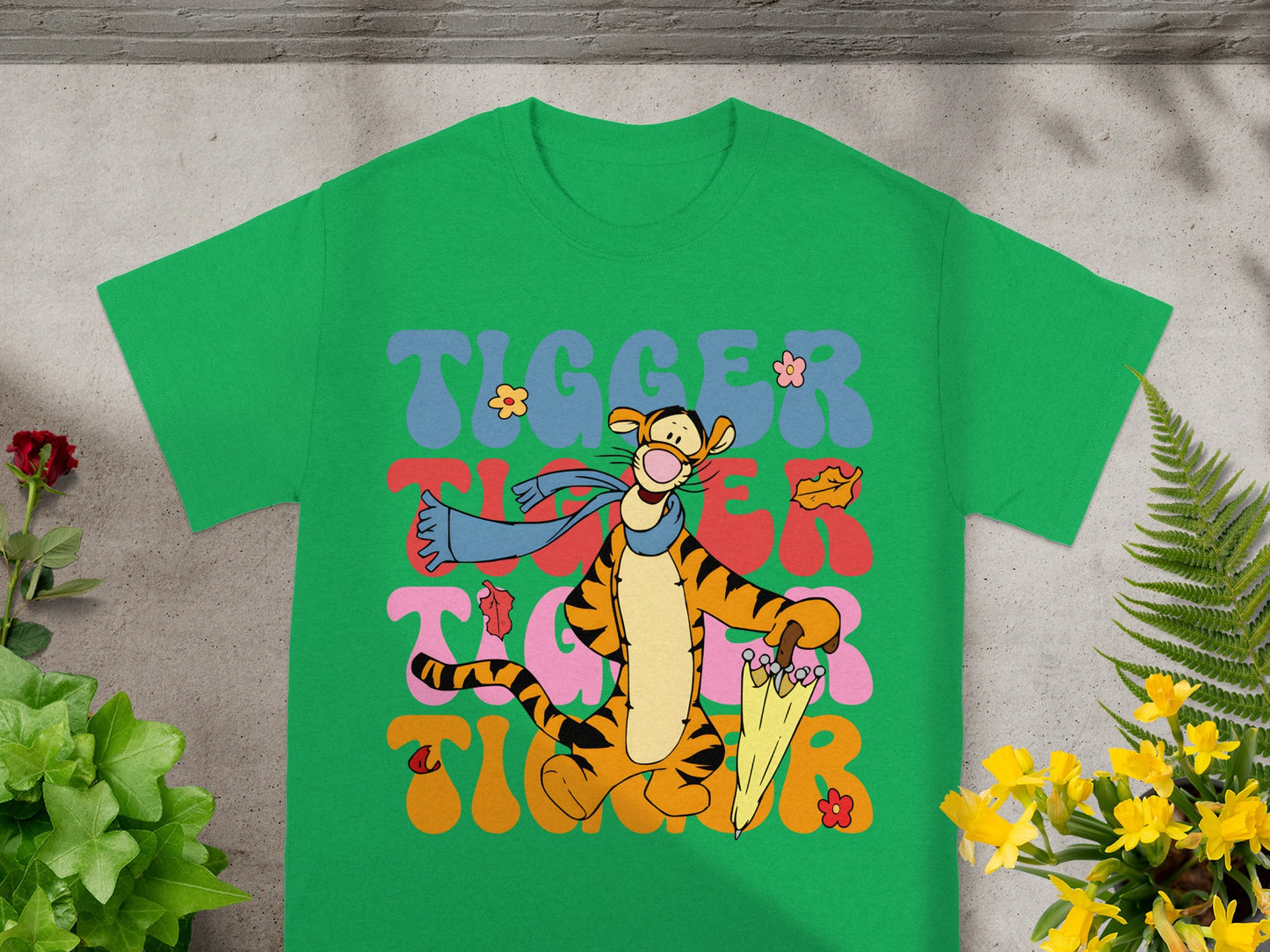 Green t-shirt with Tigger character and colorful "Tigger" text.