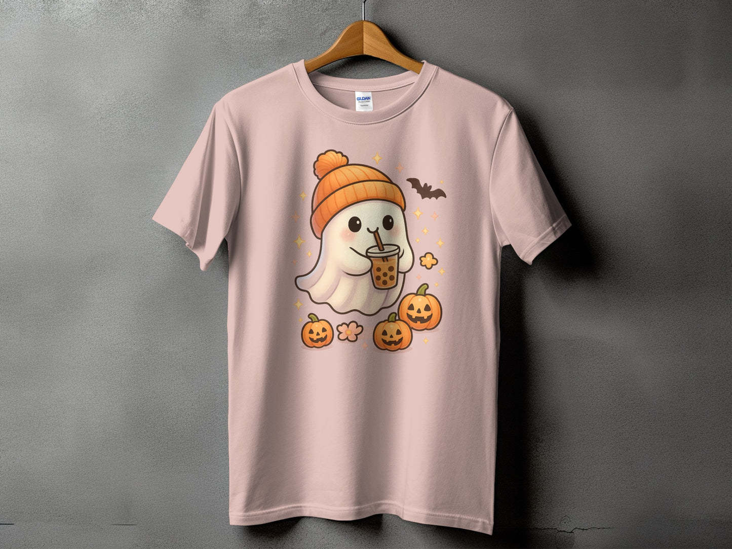 Ghost wearing an orange hat drinks boba with pumpkins and a bat.