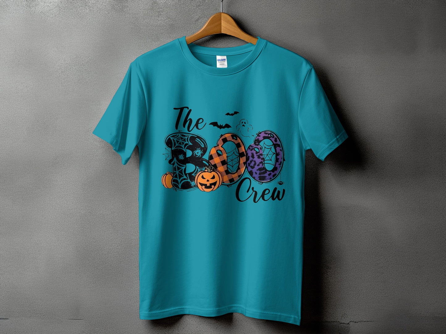 Teal t-shirt with "The BOO Crew" Halloween graphic featuring pumpkins and bats.