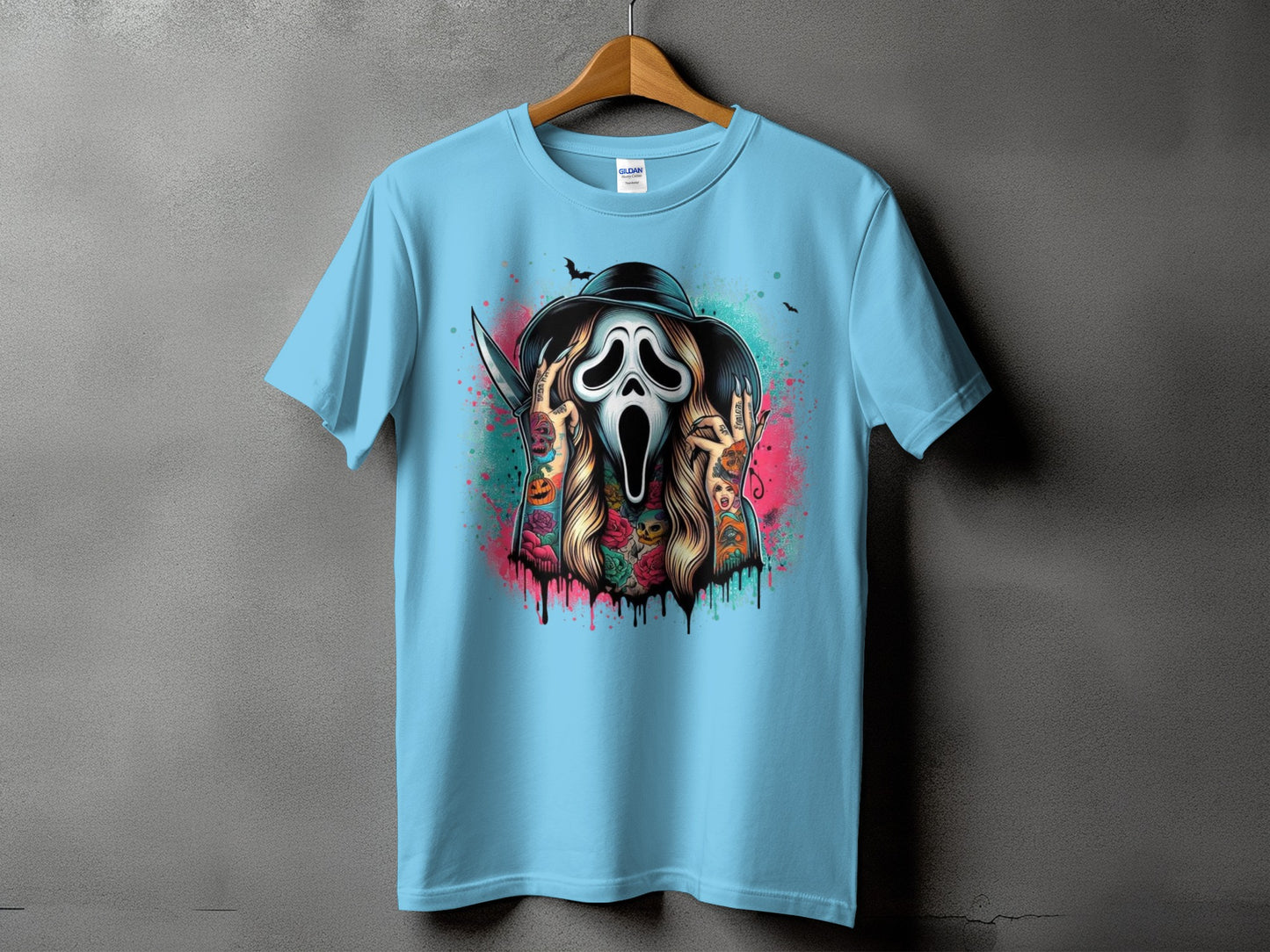 Light blue t-shirt with Ghostface, knife, and colorful tattoos graphic.