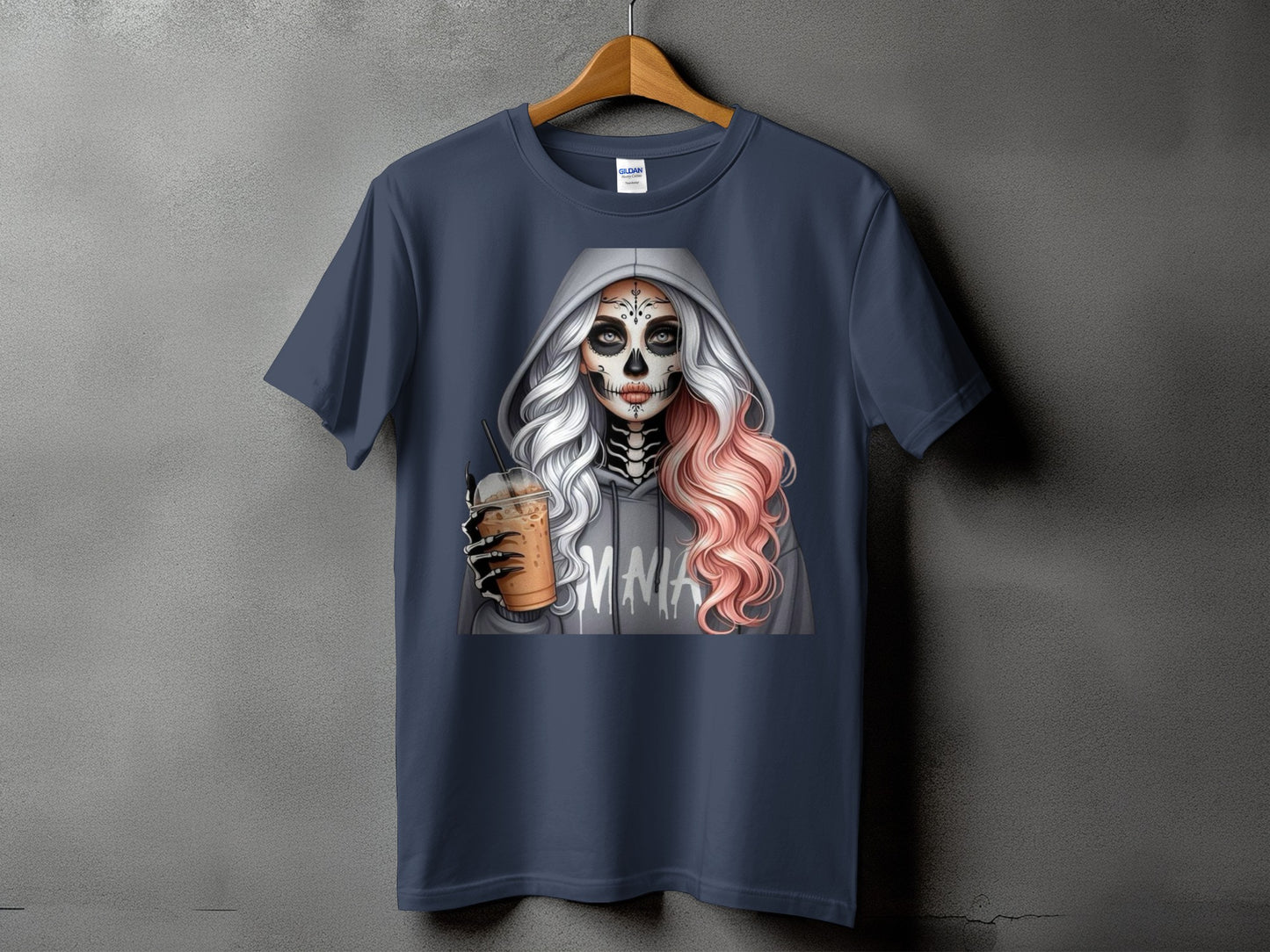 Skull makeup woman in hoodie holding iced coffee, with "MMA" text.