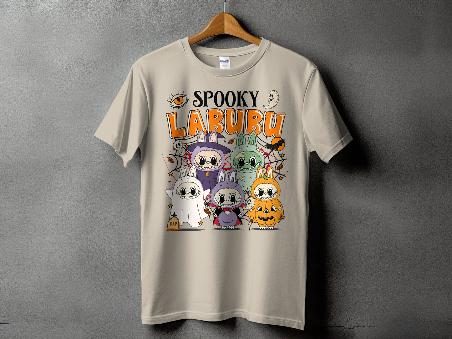 "Spooky Labubu" text with Halloween-themed cartoon characters dressed as a ghost, vampire, and pumpkin.