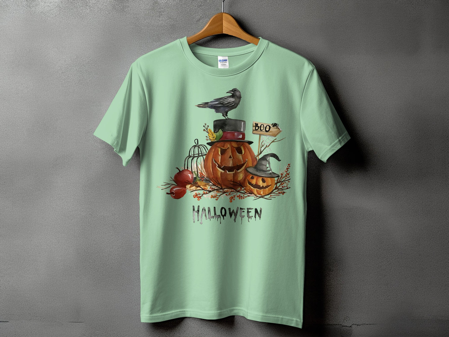 Green t-shirt with Halloween pumpkins, crow, and "Halloween" text graphic.