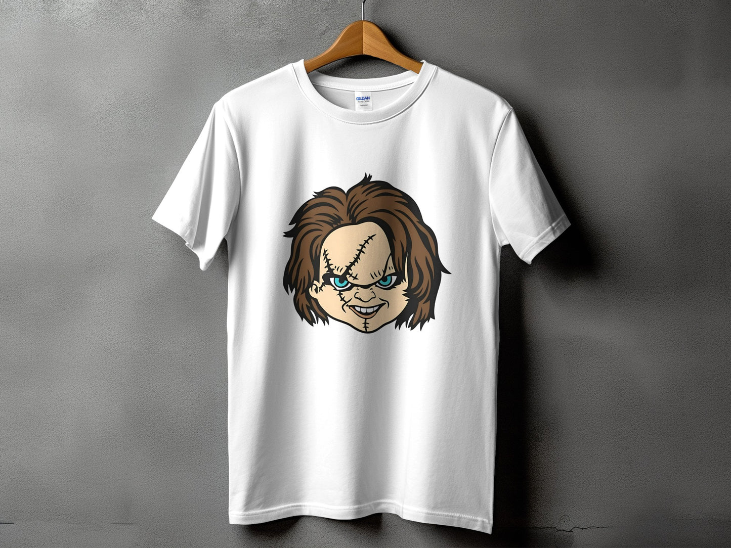 White t-shirt with a Chucky doll graphic on the front.