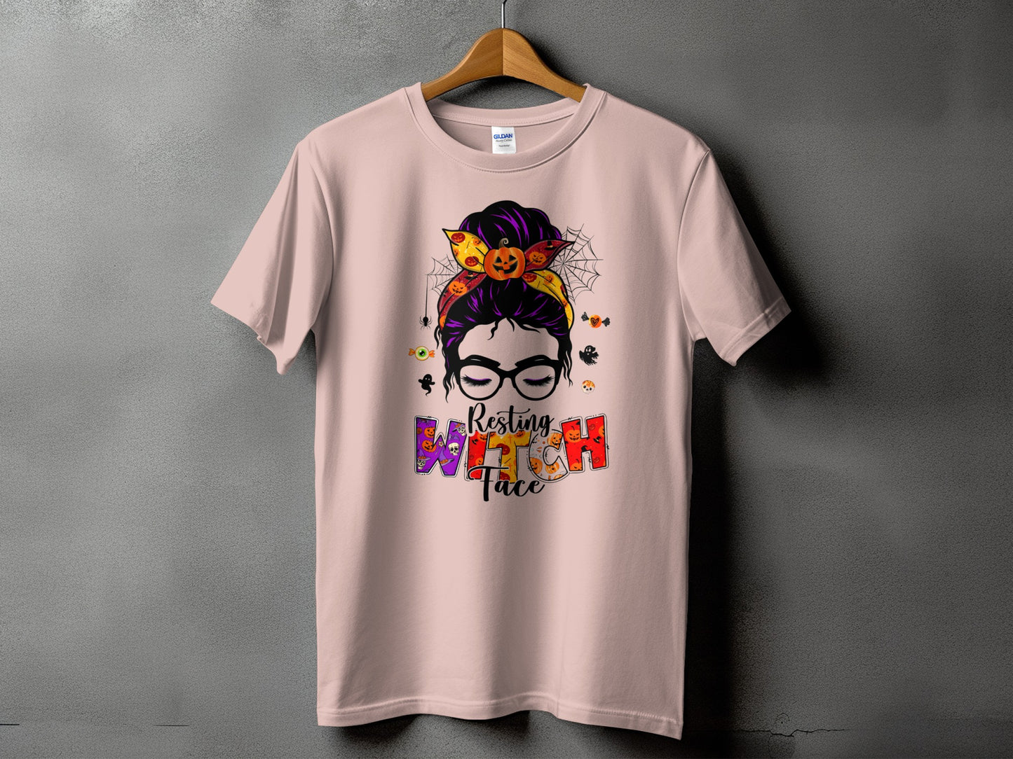 Pink t-shirt with Halloween graphic reading "Resting Witch Face."