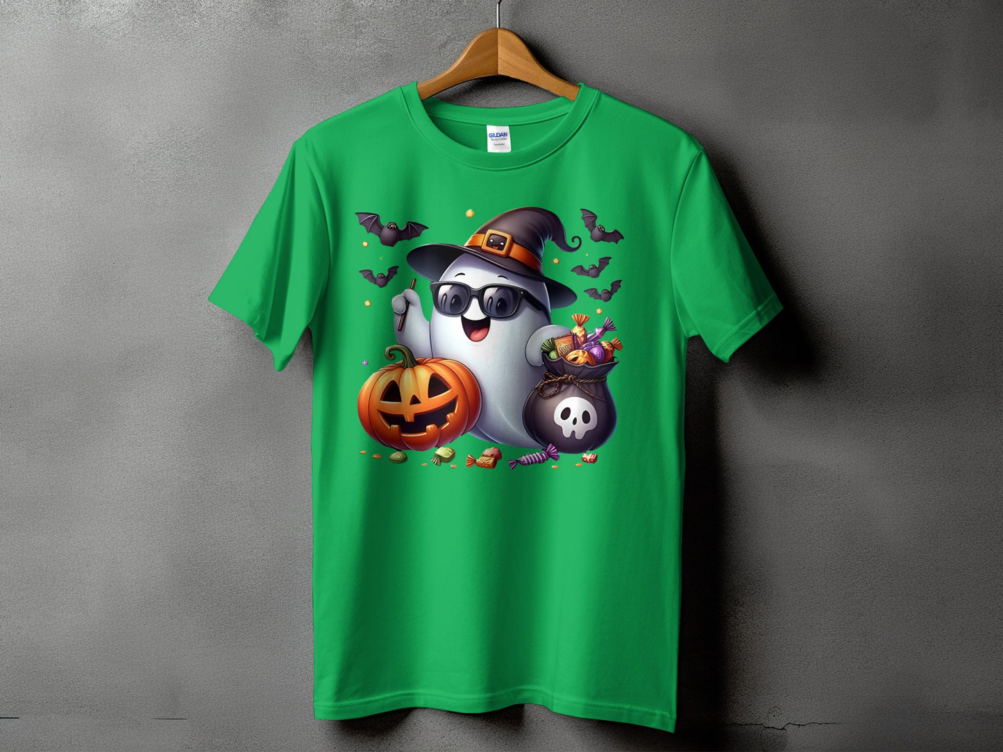 Green t-shirt with Halloween ghost, pumpkin, candy, and bats graphic.