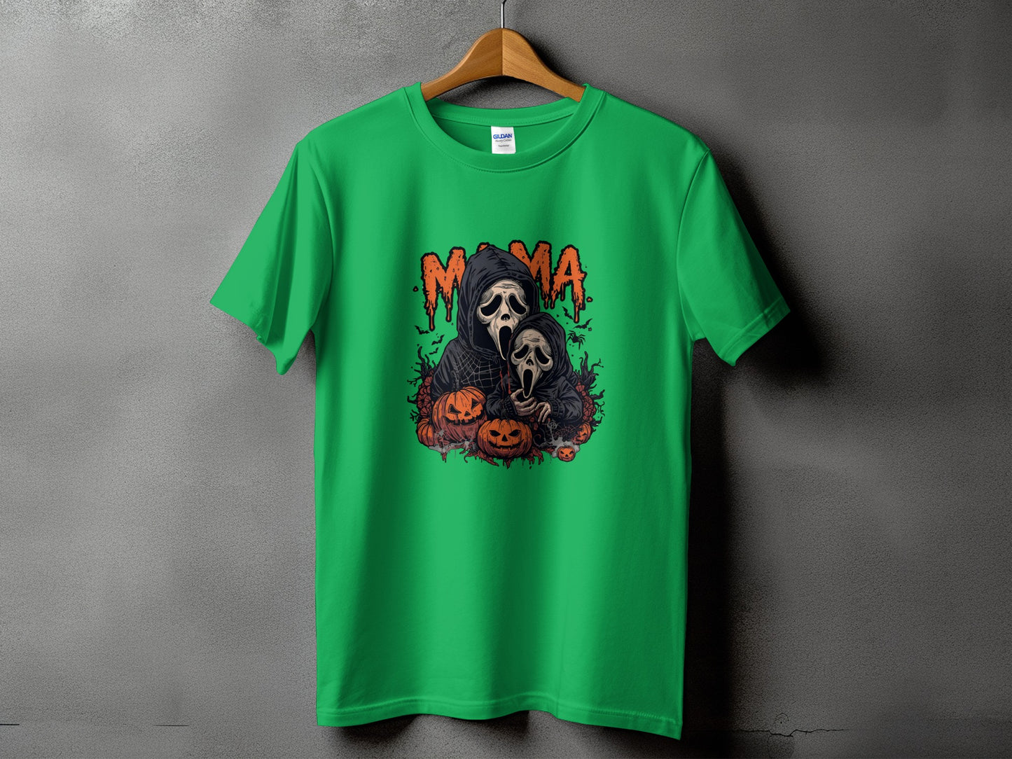 Green t-shirt with "Mama" text and ghost-like figures with pumpkins.