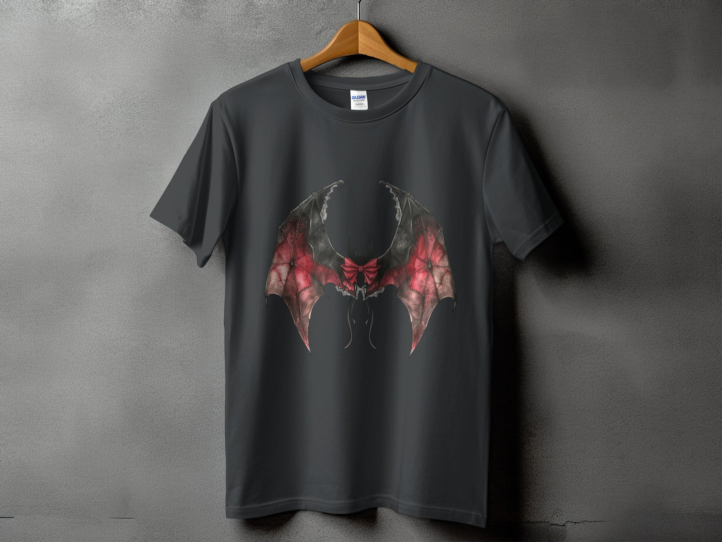 Dark grey t-shirt with gothic bat wings and red bow graphic.