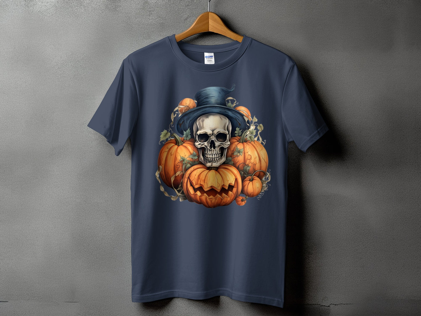 Skull and pumpkins wearing a top hat on a dark blue t-shirt.