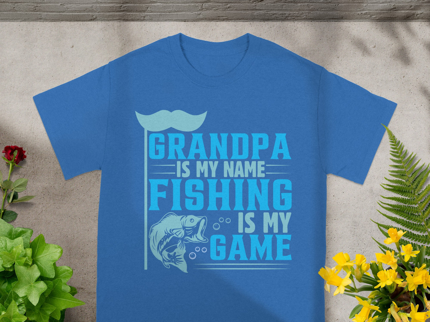 Blue t-shirt with text: Grandpa is my name. Fishing is my game.