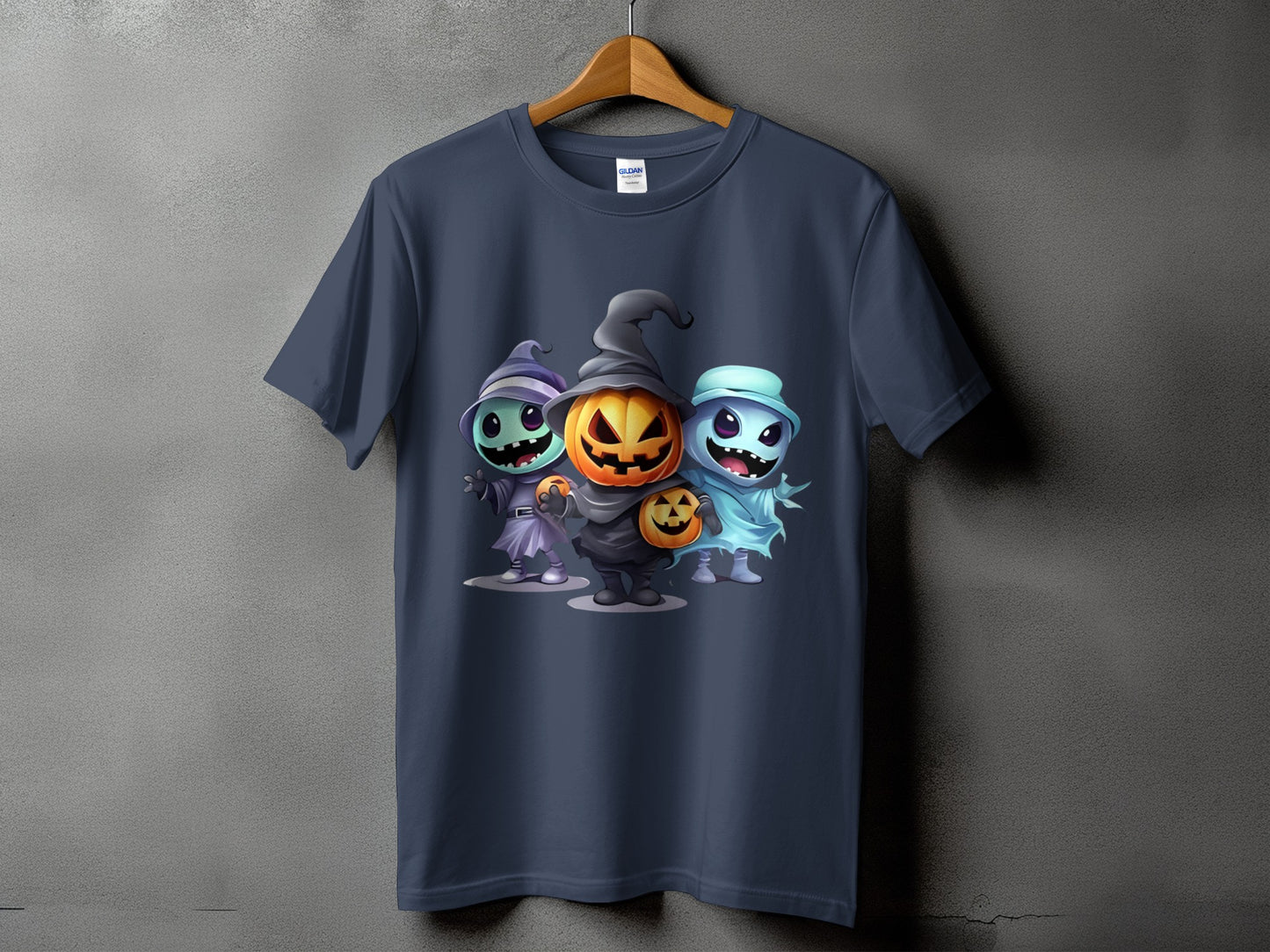 Dark blue t-shirt with cartoon Halloween characters: witch, pumpkin, and ghost.