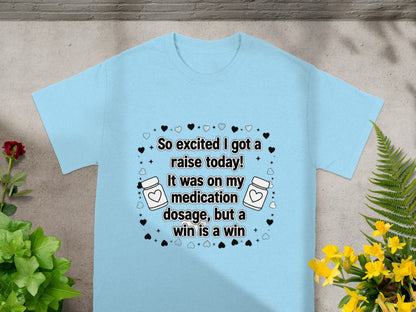 Light blue t-shirt with "So excited I got a raise today!" text.