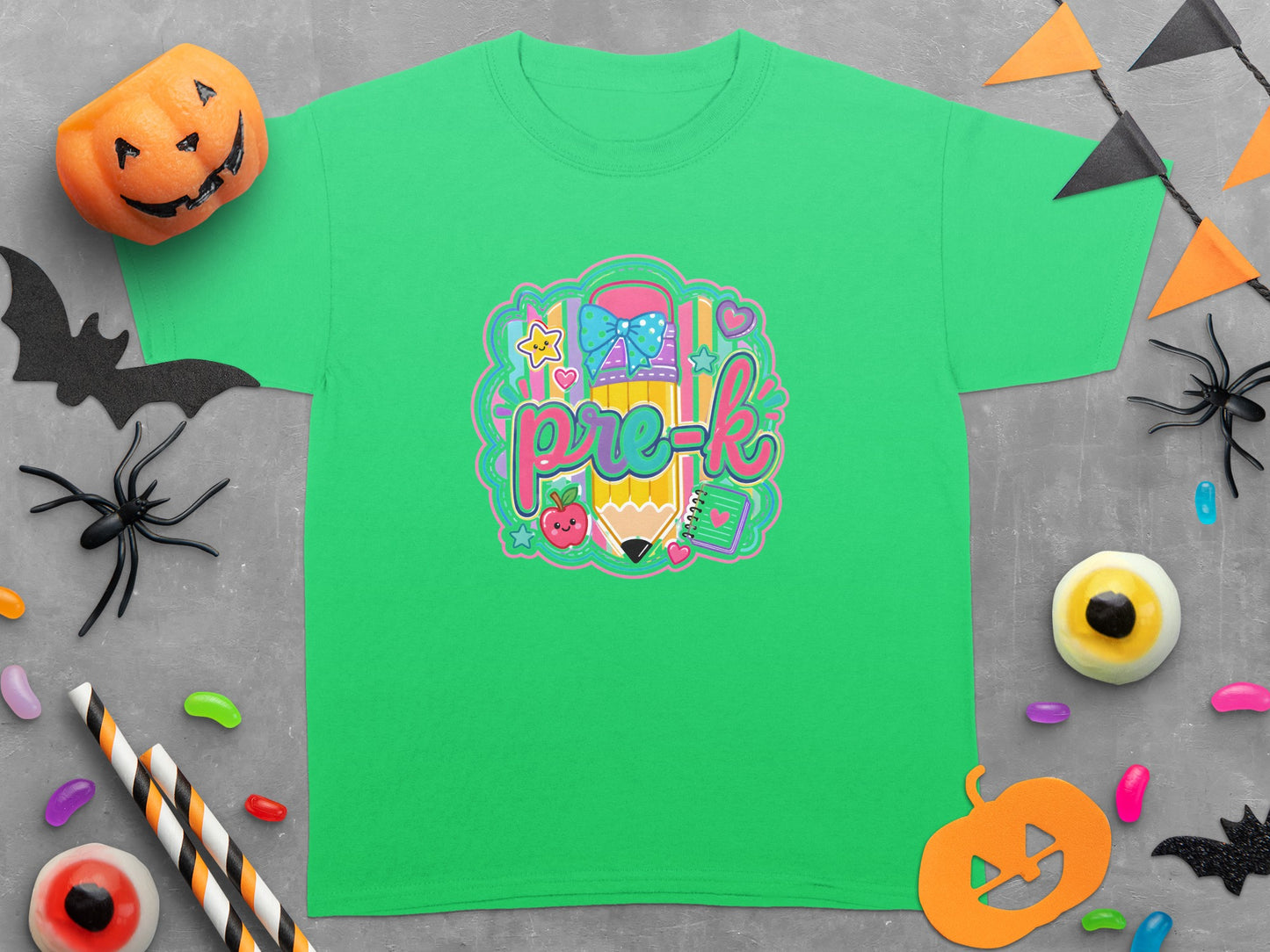 Green t-shirt with a colorful "pre-k" graphic featuring a pencil, apple, and stars.
