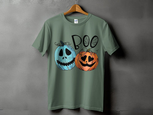 Green t-shirt with "BOO" text and two cartoon pumpkins with spiderwebs.