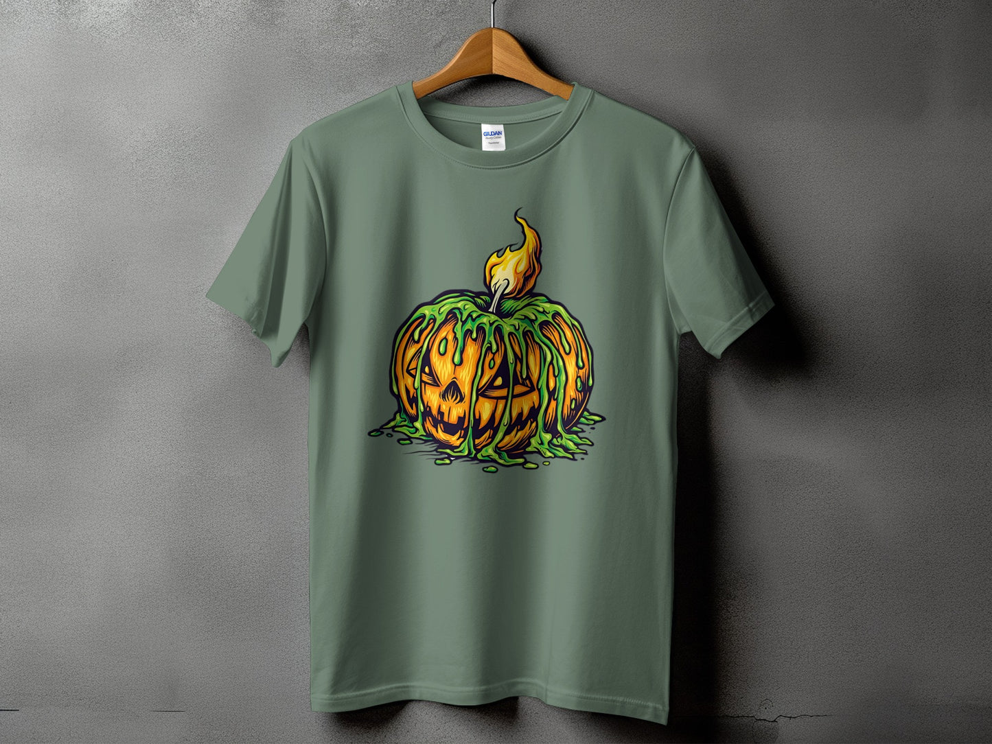 Green t-shirt featuring a jack-o'-lantern with dripping green slime and fire.