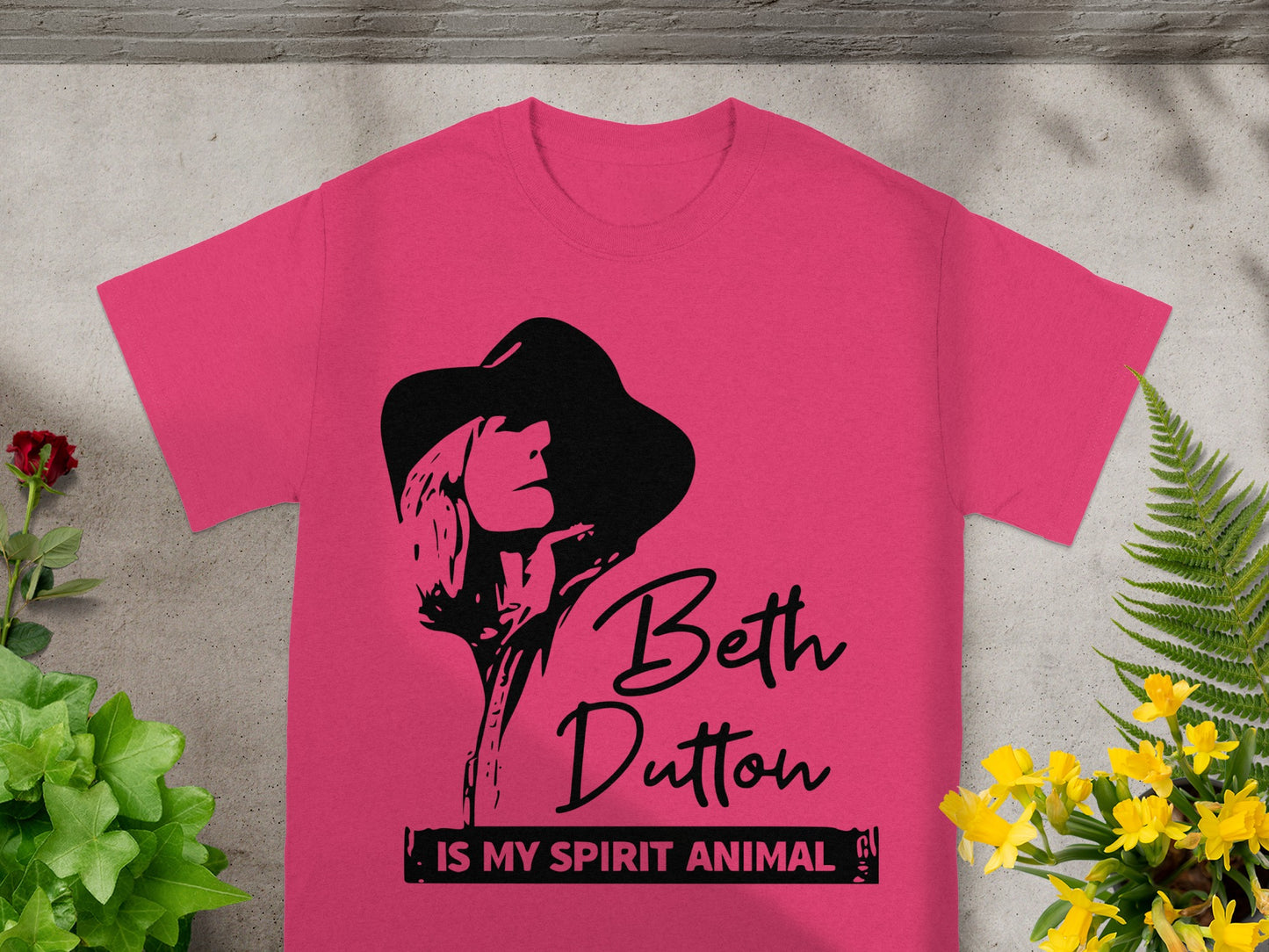 Pink t-shirt with black graphic of Beth Dutton and text "IS MY SPIRIT ANIMAL".