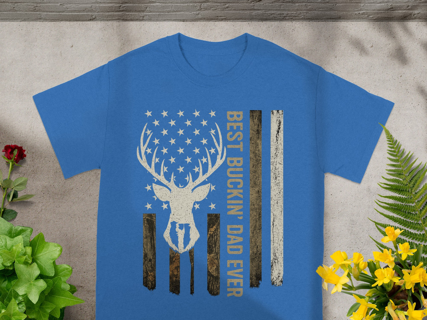 Blue t-shirt with distressed deer skull American flag and "Best Buckin' Dad Ever" text.