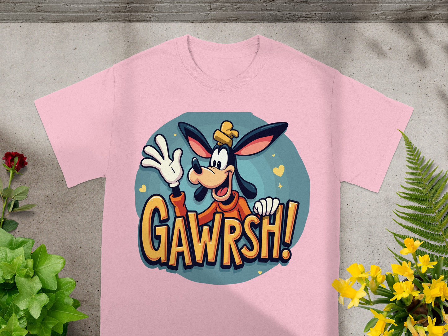 Pink t-shirt featuring Goofy character saying "GAWRSH!".