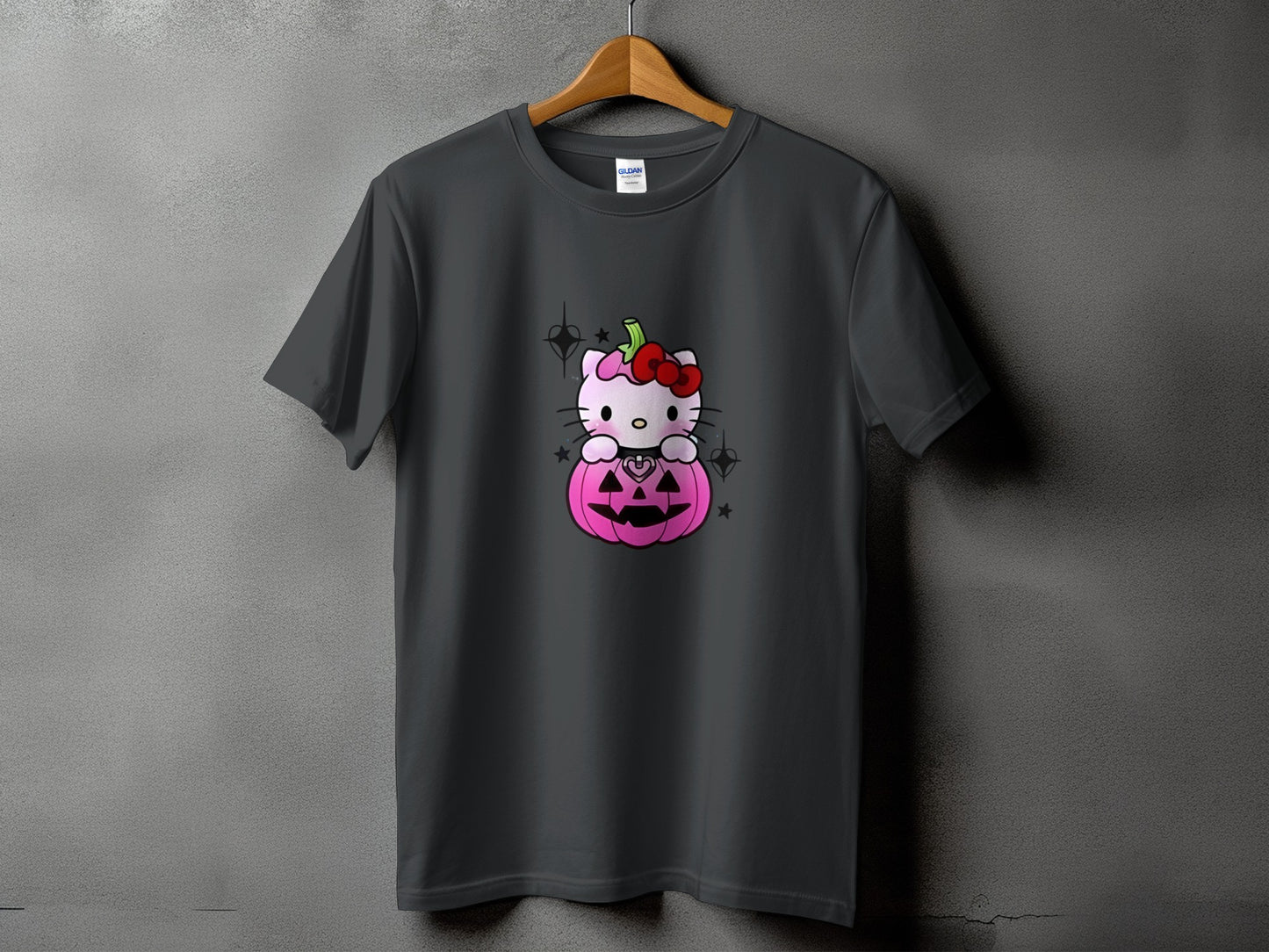 Dark grey t-shirt with Hello Kitty inside a pink jack-o'-lantern.